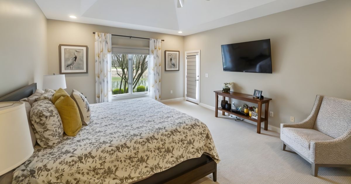 Soft neutral staged bedroom with natural light for home sale preparation