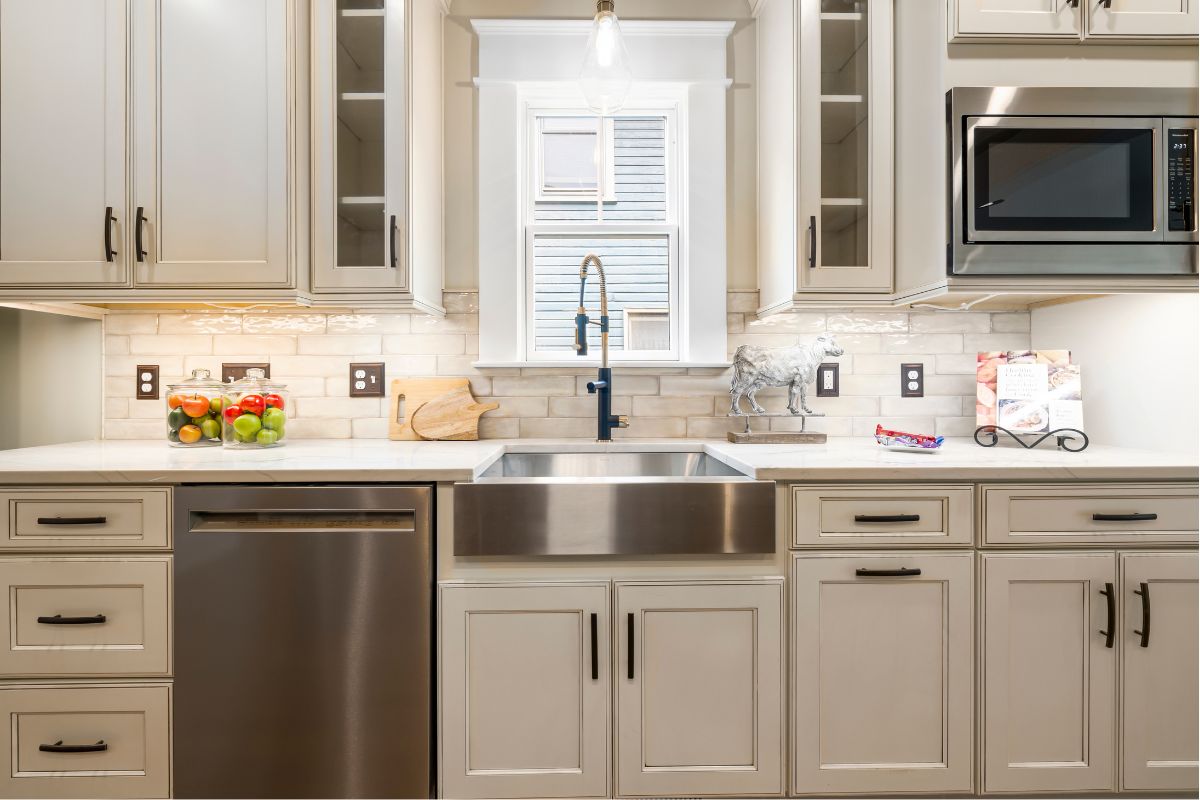 Bright uncluttered kitchen with clear countertops prepared for real estate listing photos