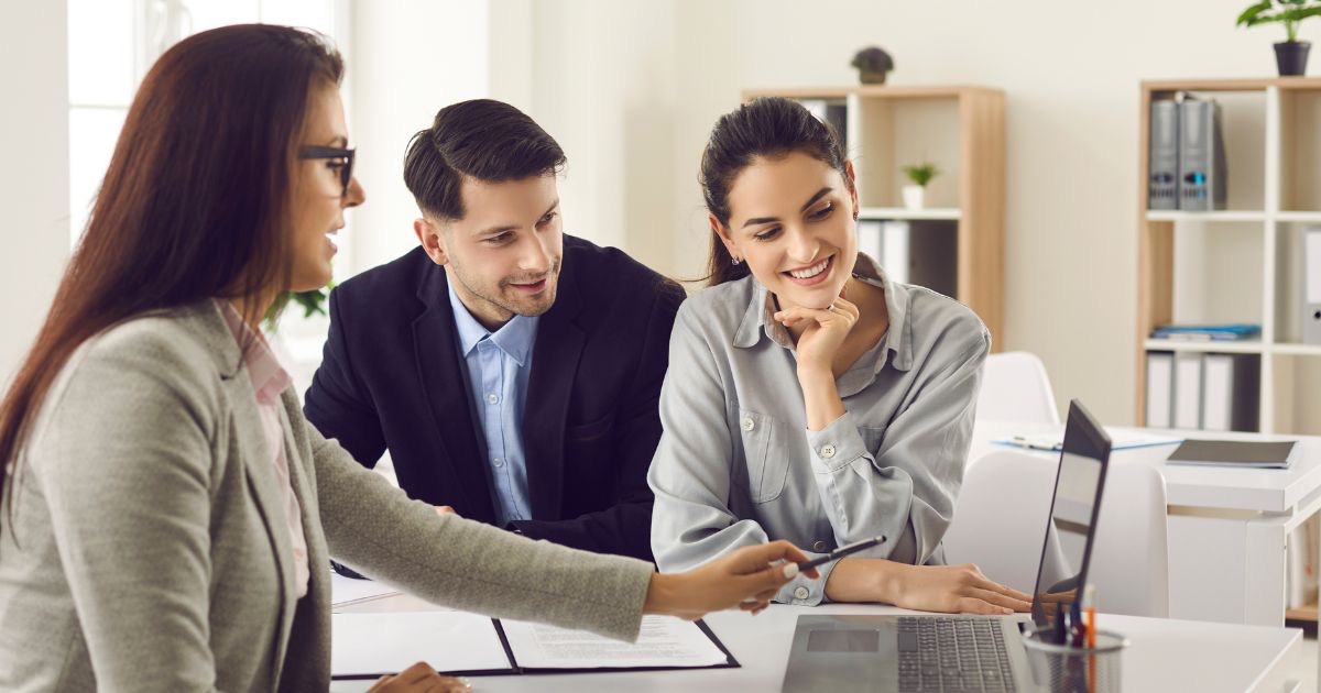 Central Ohio homeowners reviewing a home pricing strategy before listing