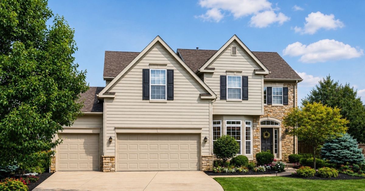 Welcoming Central Ohio home exterior with tidy landscaping and a staged front entry