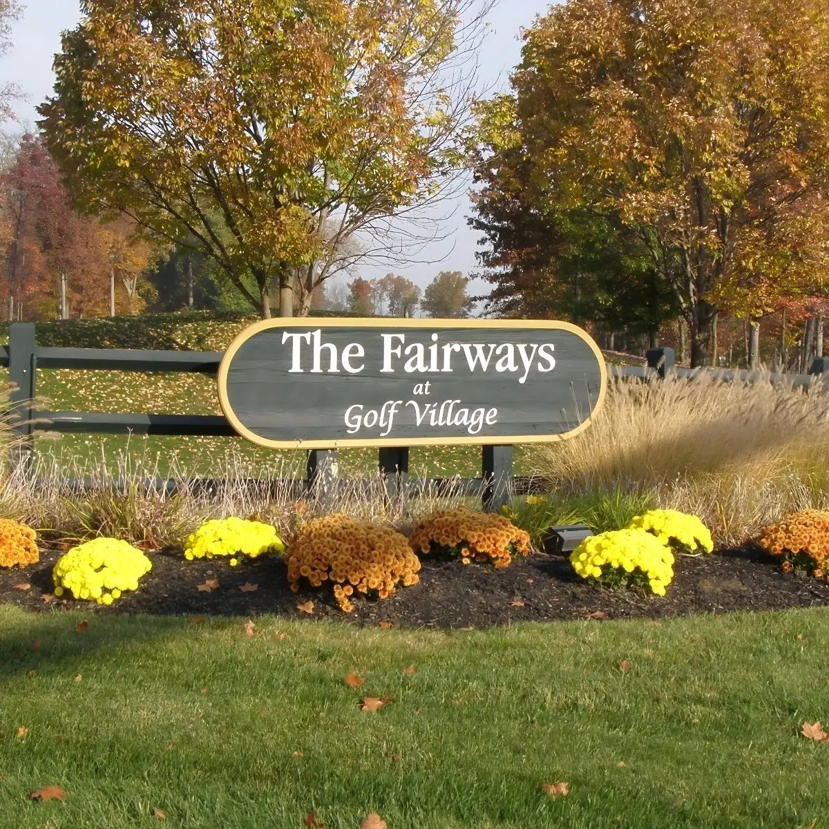 The Fairways at Golf Village entrance sign with autumn landscaping in Dublin, Ohio.