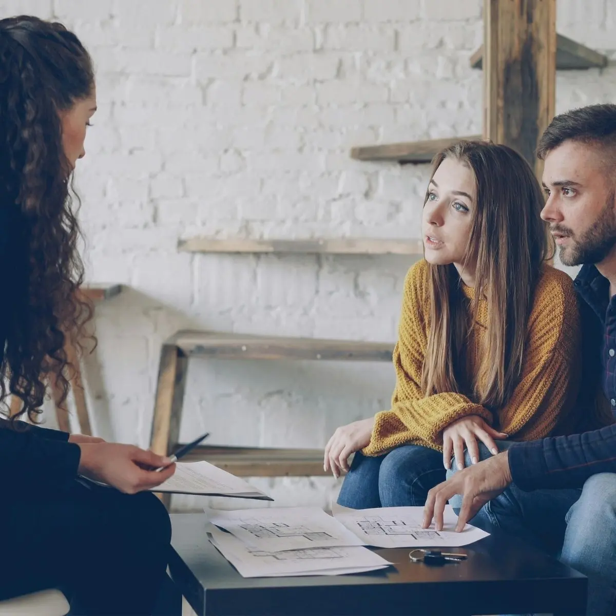 Homeowners discussing their financial options with a professional