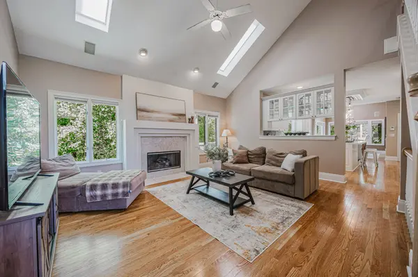 Bright living room with fireplace and hardwood floors in a Central Ohio home