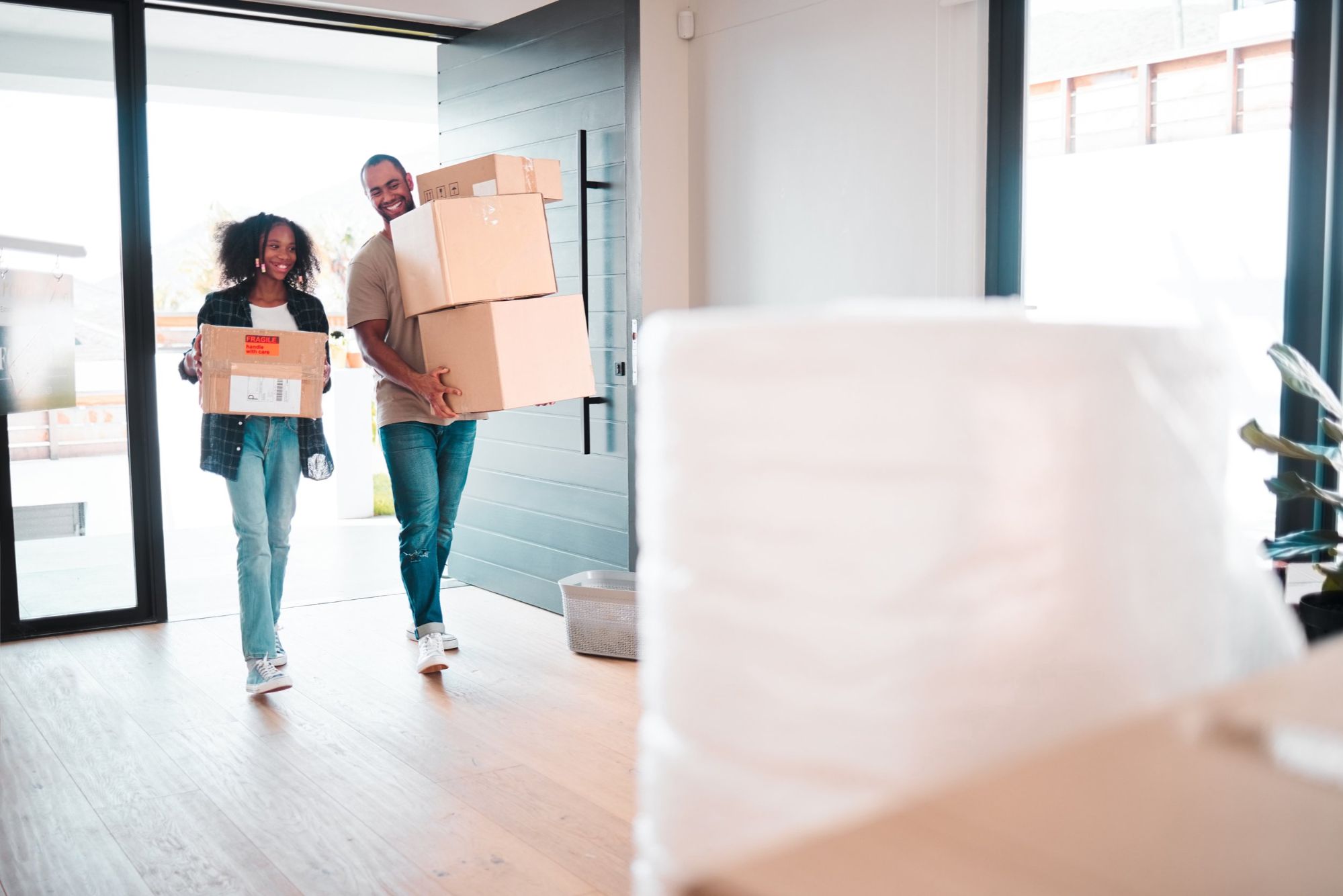 Young family moving into their new home - Helped by Ted Moseley and Orlando Nest