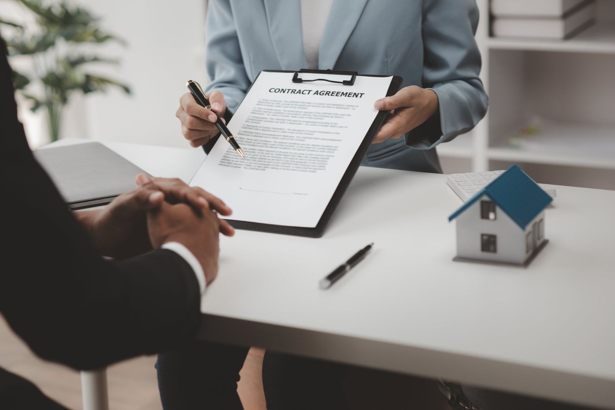 Real estate agent explains the closing process to a client