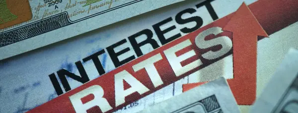 Mortgage paperwork and a calculator on a desk after the Federal Reserve raised rates