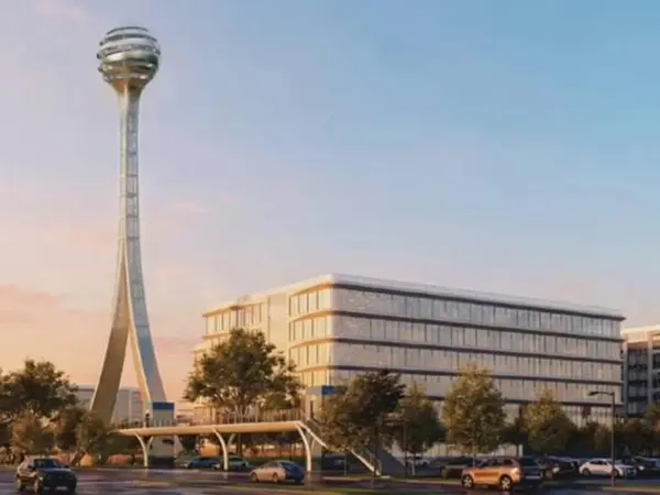 Rendering of AT&T's planned Plano headquarters campus, with its observation tower, at sunset