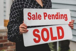 Selling image with a 'Sale Pending' sign background