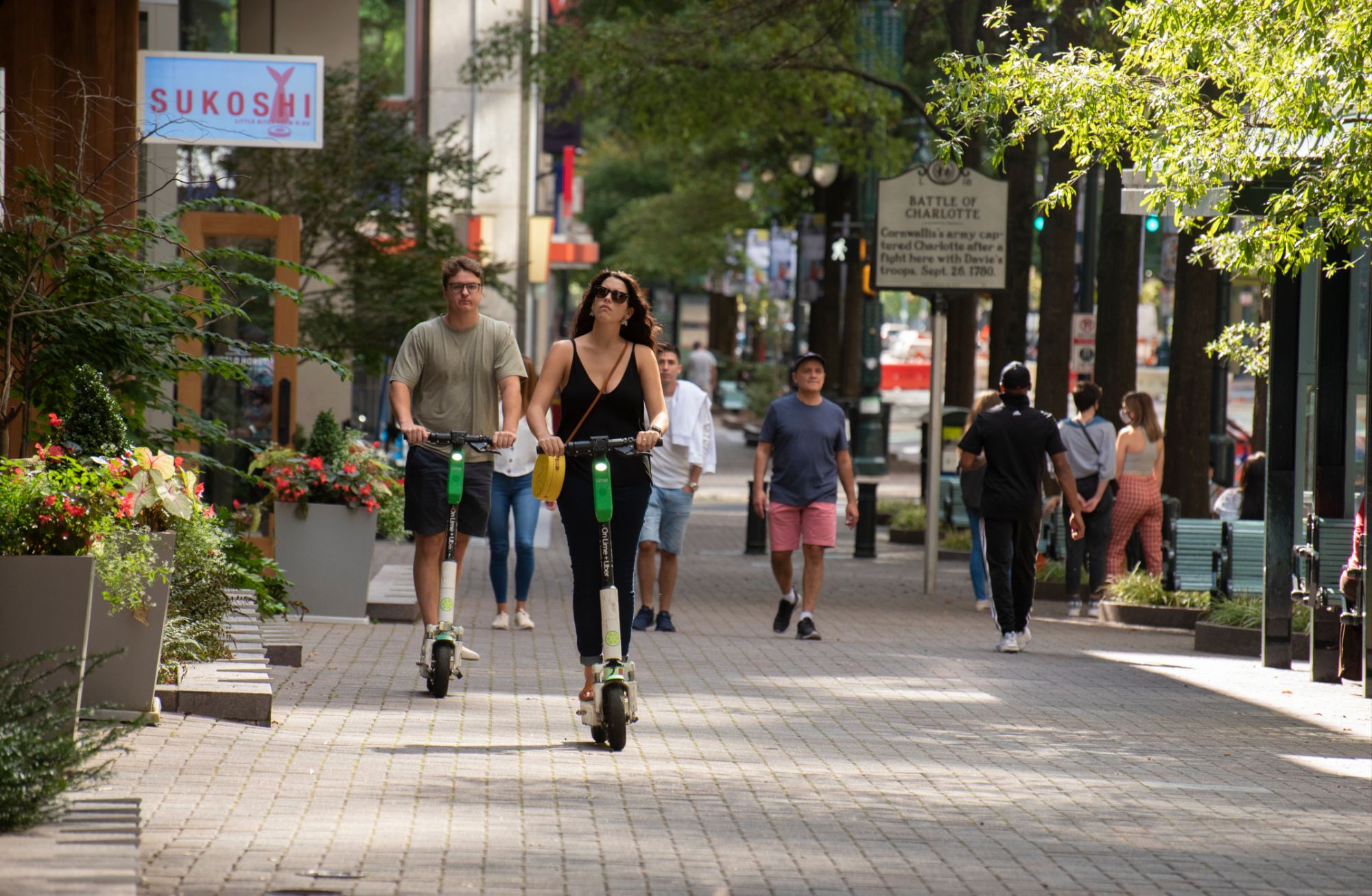 People on Scooters in South End