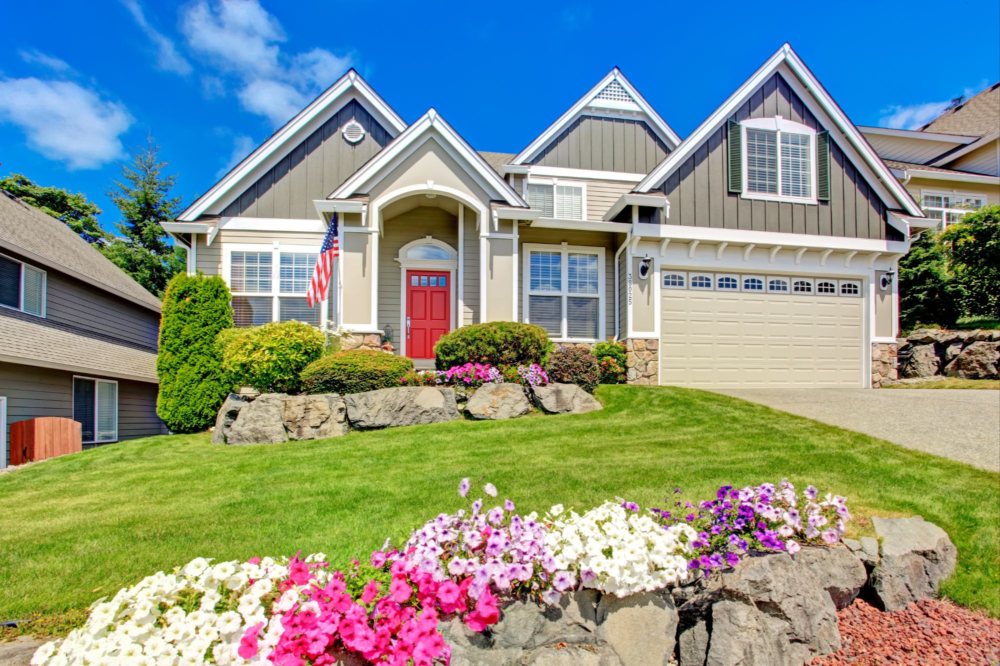 Newer Construction Home with flowers out front