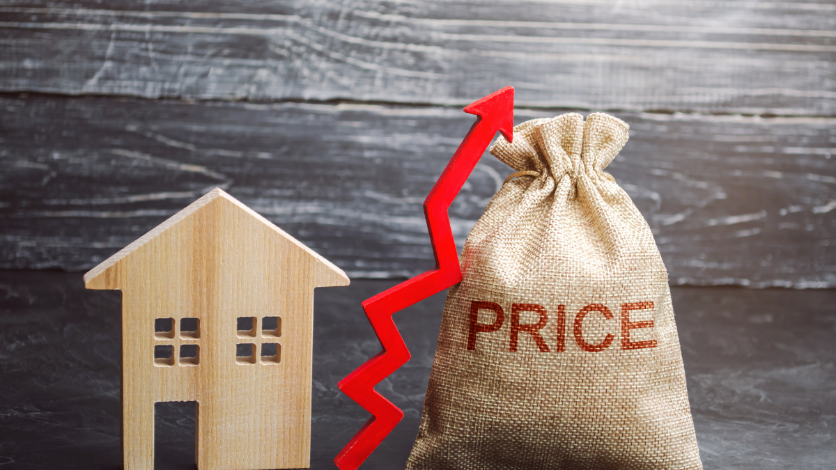 House icon next to a bag labeled “price” with an upward arrow, illustrating rising house prices.
