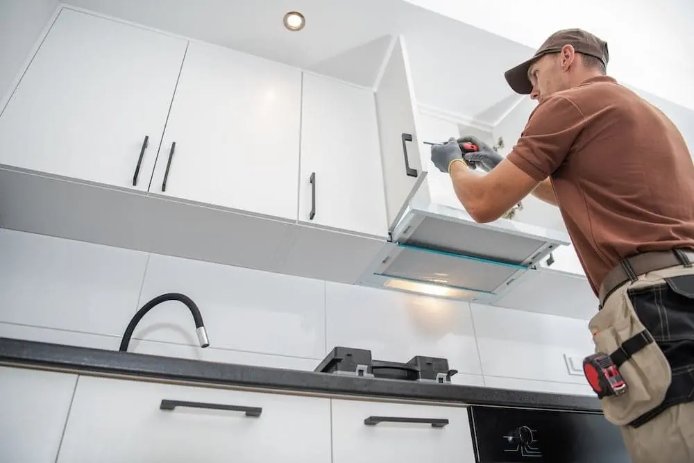 Worker improving home for sale