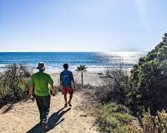 Active seniors walking the paved coastal trails at Salt Creek Beach in Dana Point, California.