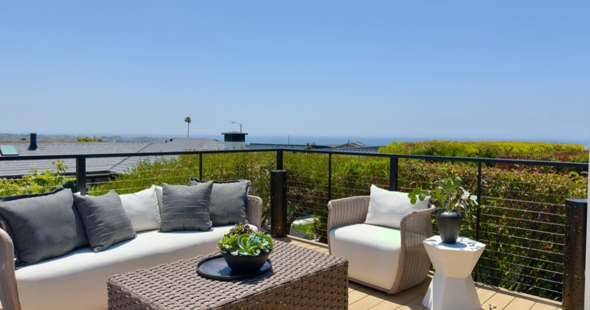 Susan Chase real estate: Modern luxury single-story home with panoramic ocean views in a gated Dana Point community like Niguel Shores or Monarch Bay.Modern luxury single-story home interior with ocean views in a gated Dana Point community.