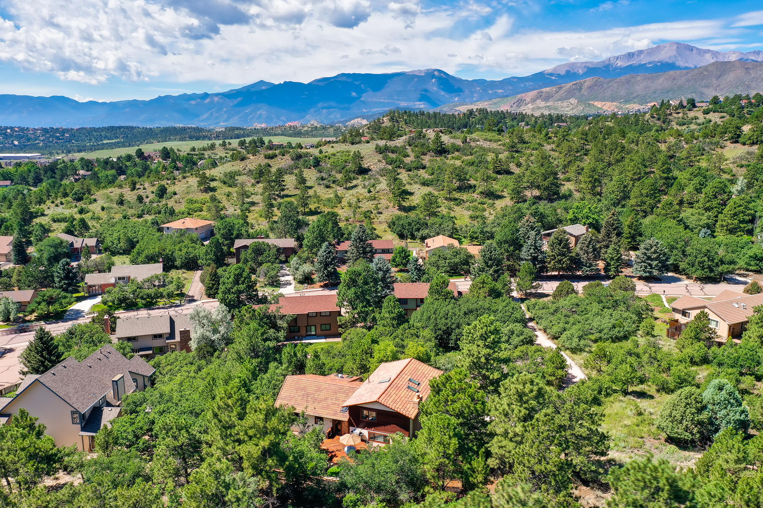 Aerial view of Rockrimmon neighborhood Colorado Springs with Pikes Peak backdrop