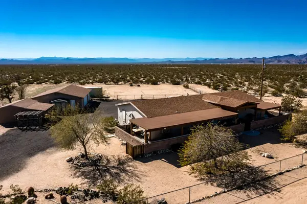 Image of ranch style home in vast desert setting