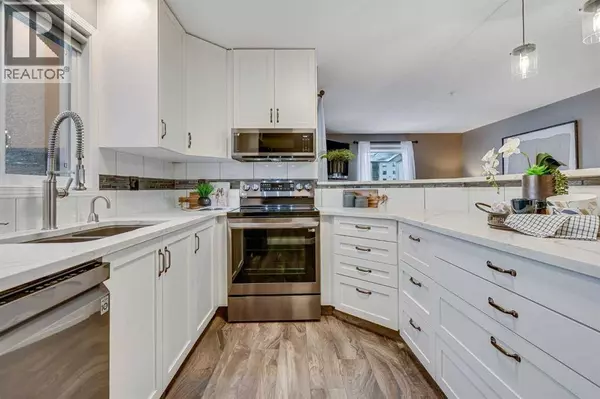 8128, 304 Mackenzie Way SW, Airdrie, AB T4B3H8