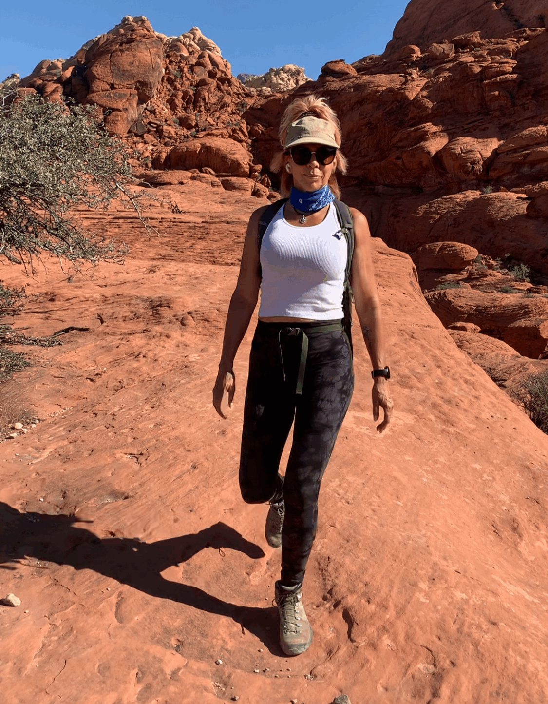 Shaaron hiking among red rock formations