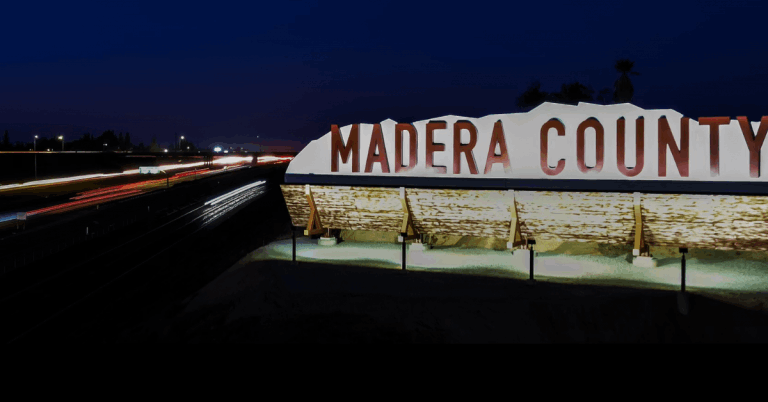 Aerial view of Southeast Madera County showing rolling hills, agricultural land, residential communities, and Sierra Nevada mountains in the background