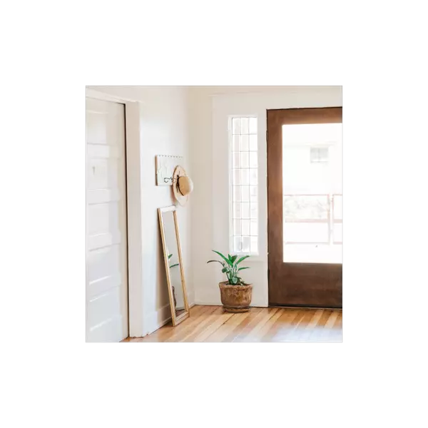 Bright room with open doorway representing opportunity and home search strategy.