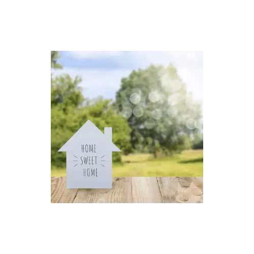 Small wooden house outdoors symbolizing closing day and moving into a new home.