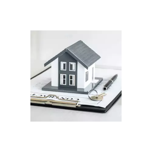 Miniature house sitting on a document, representing offers, contracts, and negotiations.