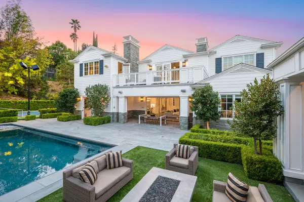 large-pool-in-front-of-a-white-house-in-encino-ca-2025-02-10-06-19-00-utc