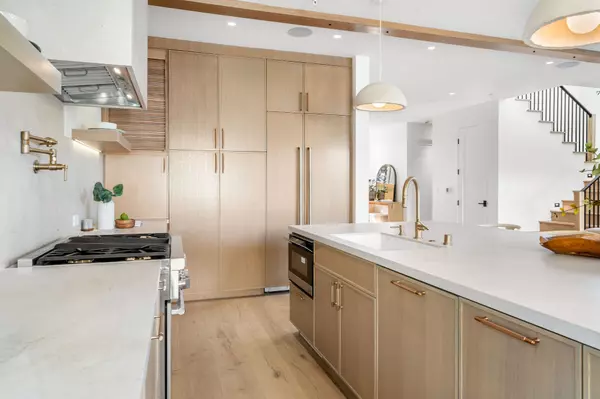 modern-kitchen-with-wooden-cabinets-and-marble-cou-2025-02-10-06-52-40-utc