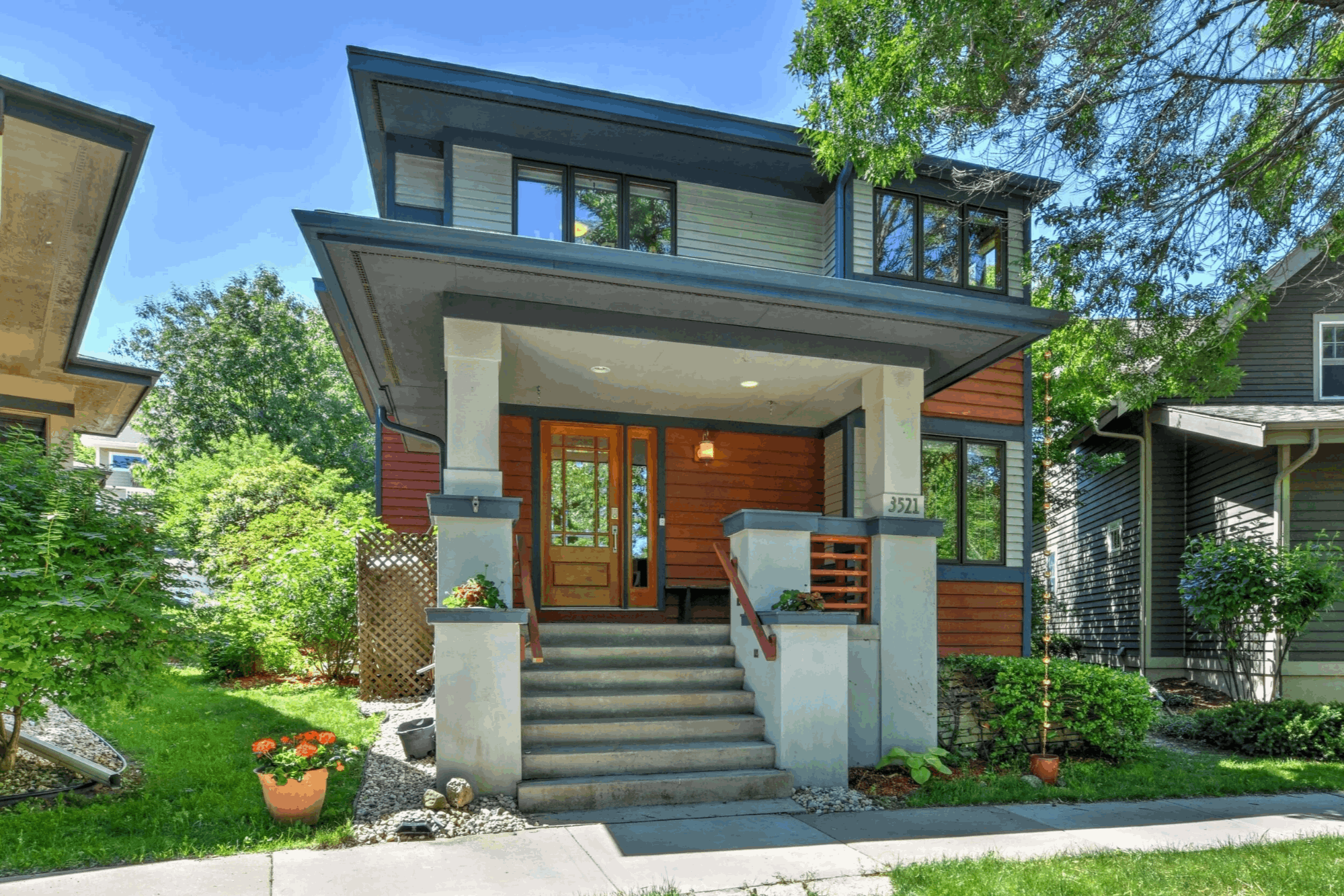 Photo of a modern multi-level home with front steps, landscape orientation