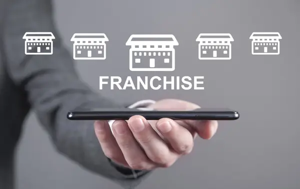 man-holding-smartphone-with-franchise-icons