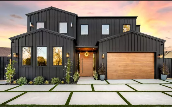 contemporary-black-house-exterior-with-wooden-gara-2025-02-10-06-40-46-utc