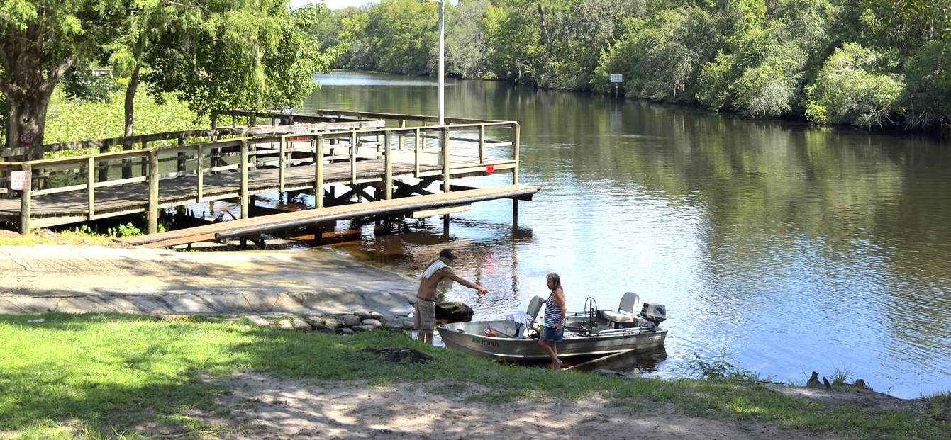Aerial view of a dock and wooded shoreline along Black Creek near Middleburg, Florida.