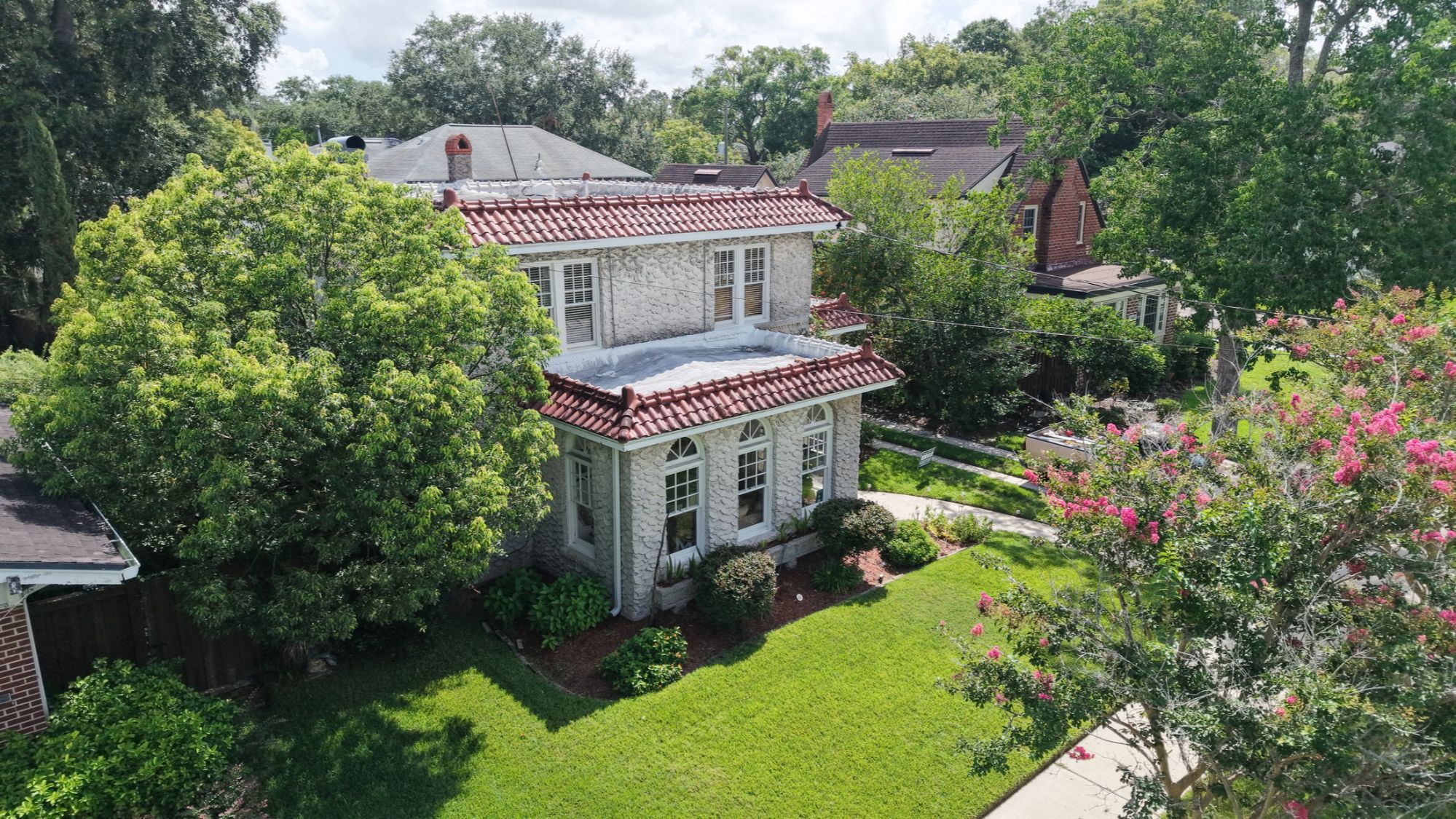 Oak-canopied residential street with historic homes in Avondale, Jacksonville, Florida.