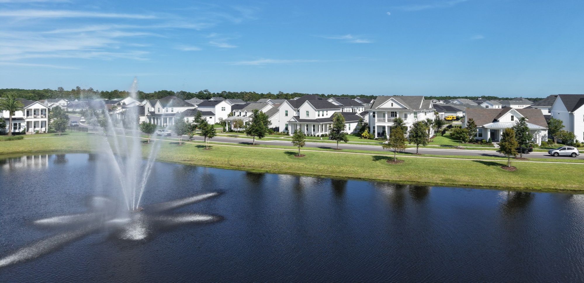 Lake with fountain and newer homes in Seven Pines, Jacksonville, Florida.