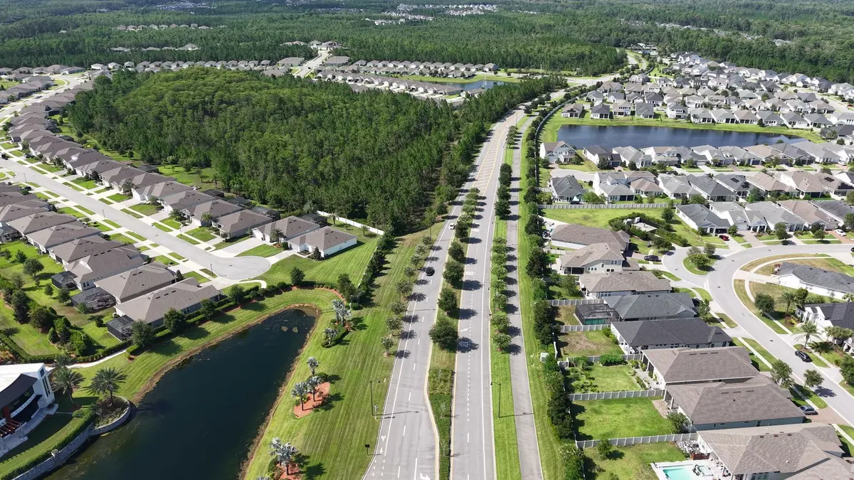 Aerial view of planned eTown neighborhoods with ponds, green space and landscaped streets.