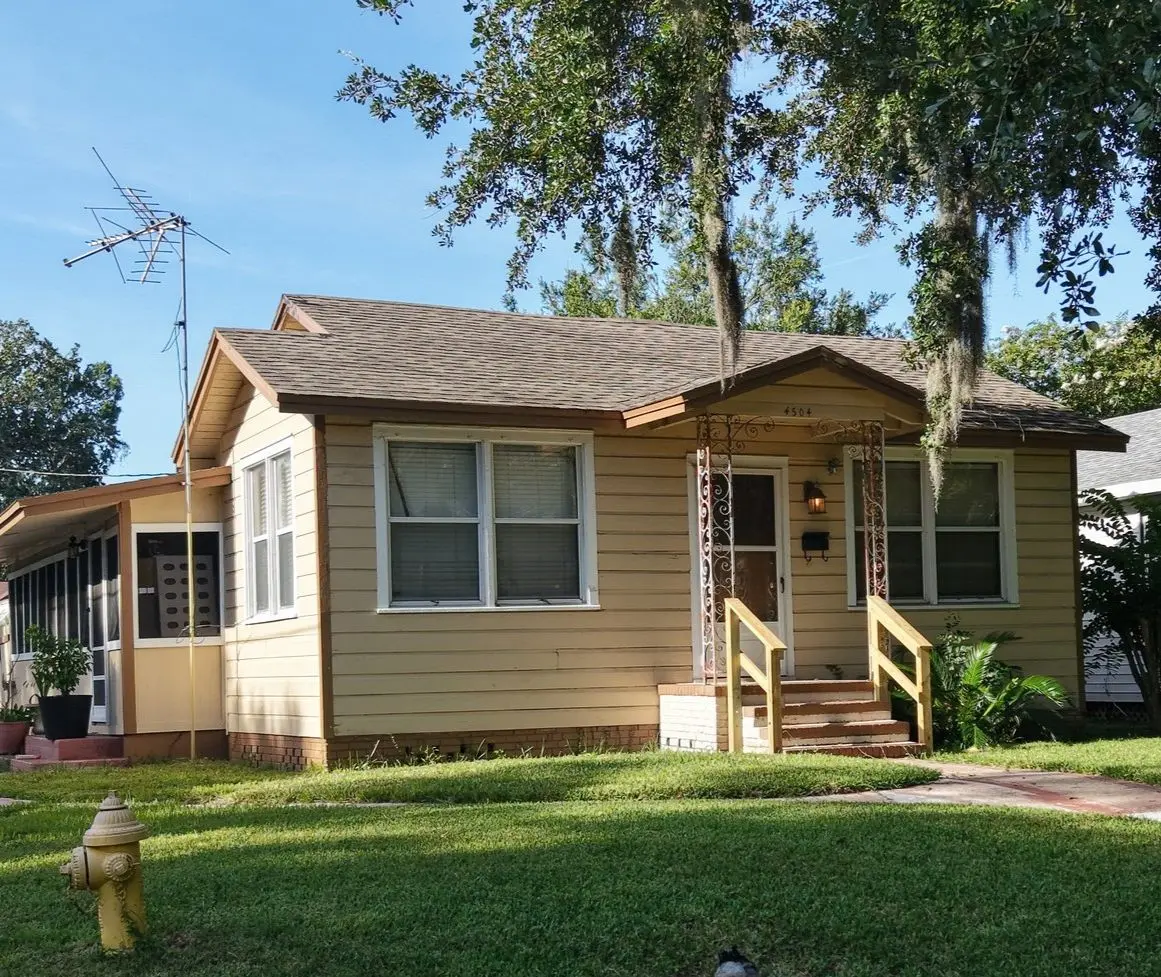 Historic bungalow-style home with mature trees in Murray Hill, Jacksonville, Florida.
