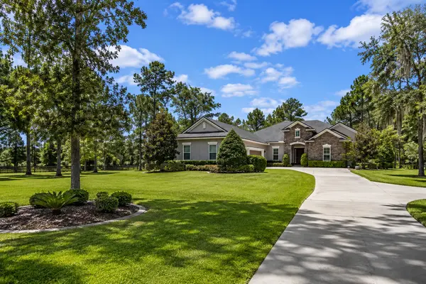 Established home on a spacious, beautifully landscaped lot in Mandarin, Jacksonville, Florida, showcasing mature trees, expansive lawns, and the larger homesites that distinguish the community.