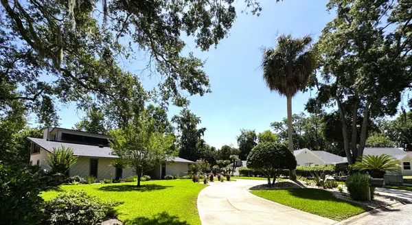 Established neighborhood in Mandarin, Jacksonville, Florida, featuring mature oak trees, spacious lots, and well-maintained homes with landscaped yards.