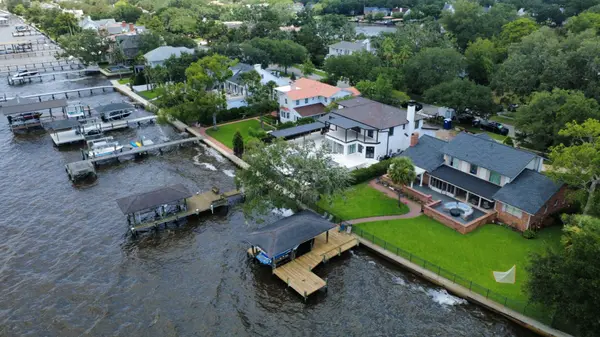 Aerial view of luxury waterfront homes with private docks along the St. Johns River in San Marco, Jacksonville, Florida.
