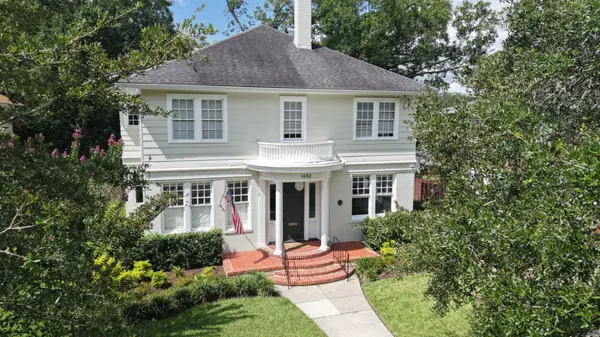 Historic two-story home with a columned entrance and mature landscaping in Avondale, Jacksonville, Florida.