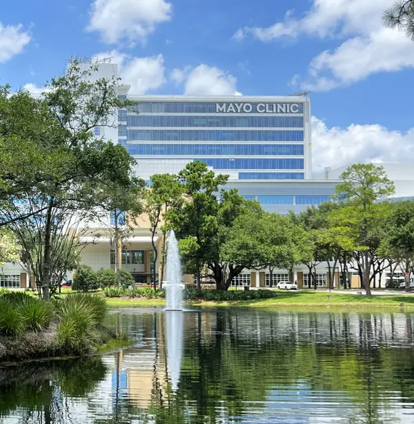 Mayo Clinic Jacksonville campus with landscaped lake and fountain near Seven Pines.