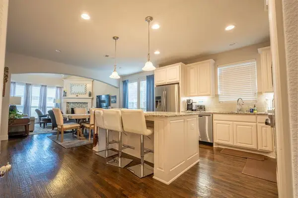 View of open kitchen looking through to dining and living rooms at 408 Highwood Trail Lewisville
