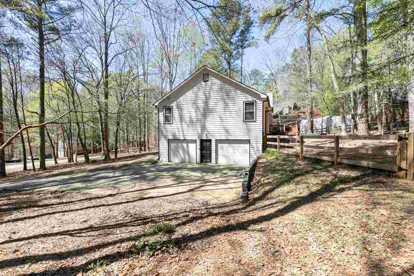 Drive-under 2-car garage with extended concrete driveway at 411 Allatoona Trail Woodstock GA