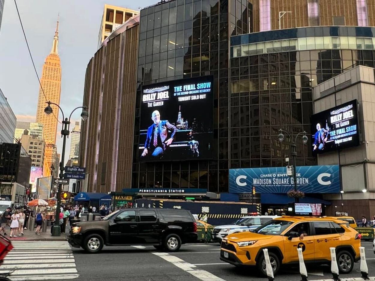 Billy Joel final concert billboard at Madison Square Garden in NYC, highlighting his legendary residency tour.