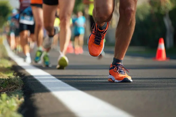 Runners feet on paved path