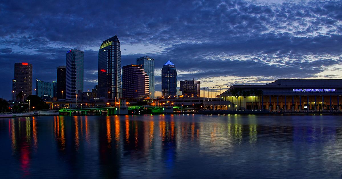 Downtown Tampa Florida skyline and convention center reflected on the Hillsborough River at dusk