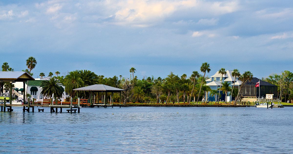 Waterfront homes with docks and palm trees along the Homosassa River in Homosassa Florida Citrus County