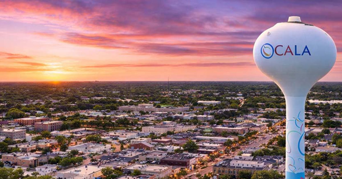 Aerial view of downtown Ocala Florida at sunset with water tower and city skyline in Marion County