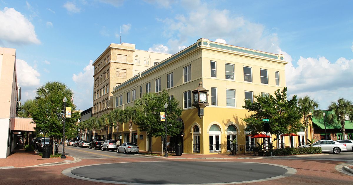 Downtown Winter Haven Florida streetscape with historic clock tower building and palm-lined Central Avenue in Polk County