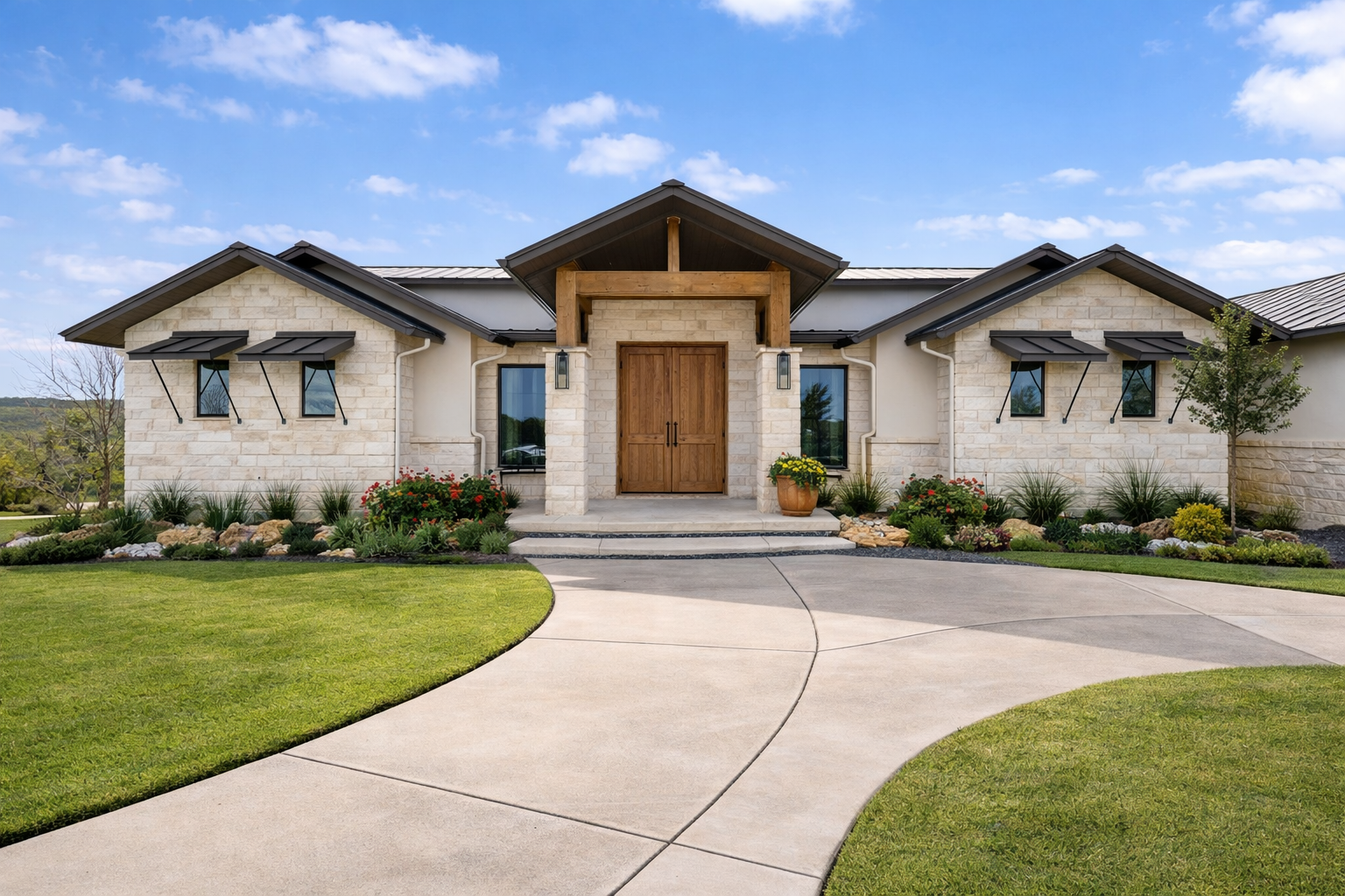 Modern Hill Country home with driveway and landscaping
